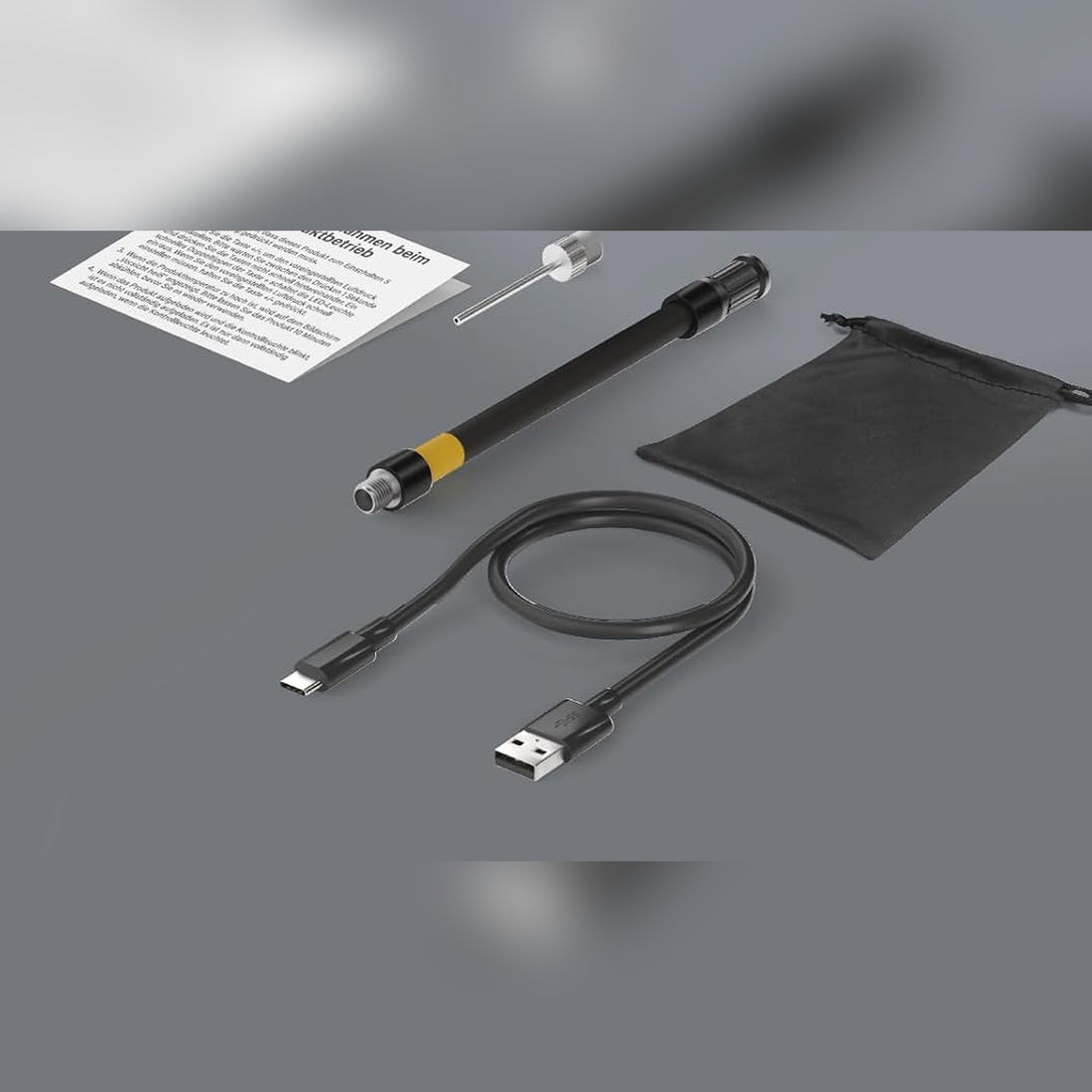 Meegeleverd: luchtslang, balnaald, opbergzakje en USB-C oplaadkabel