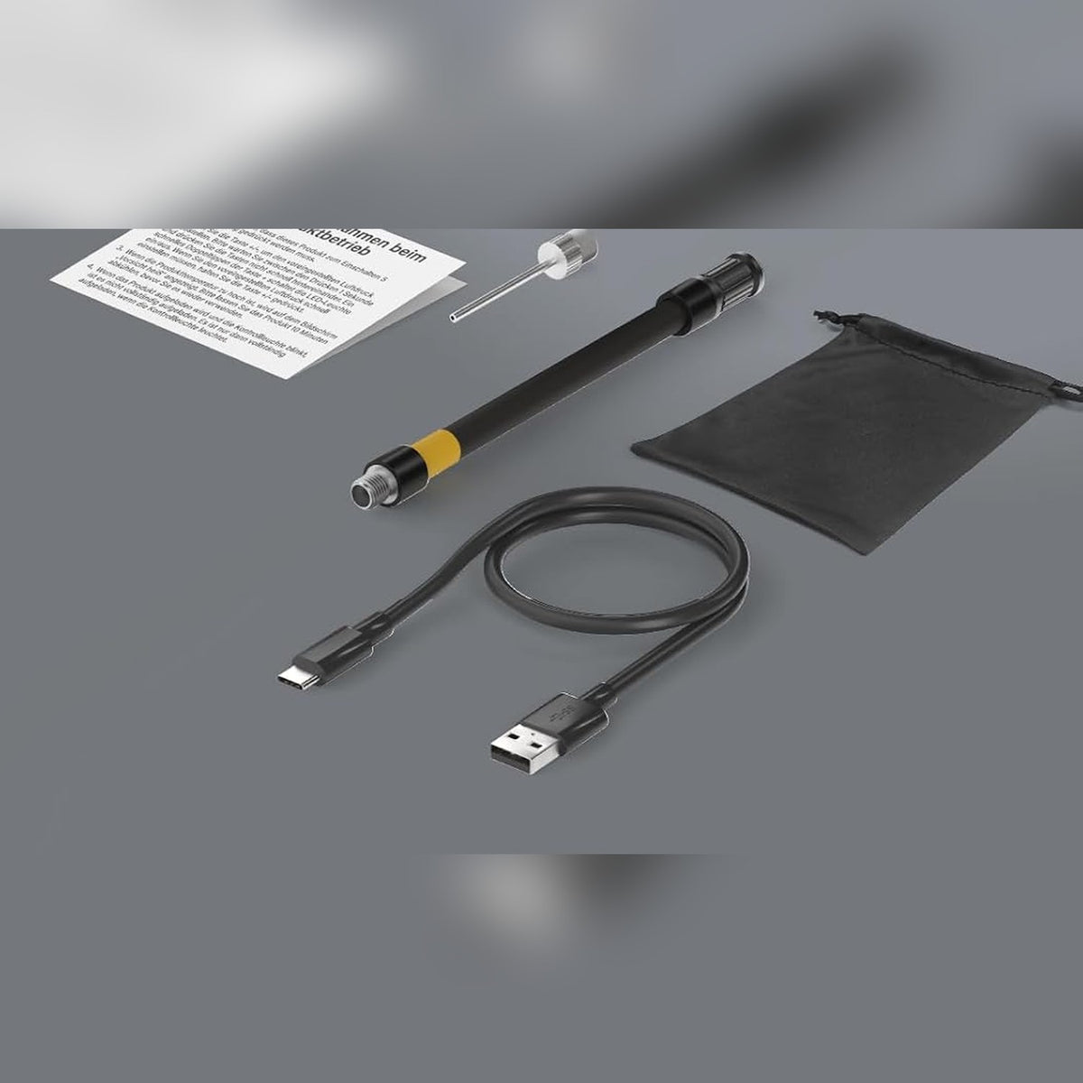Meegeleverd: luchtslang, balnaald, opbergzakje en USB-C oplaadkabel